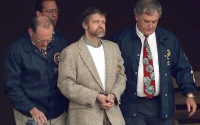 Theodore Kaczynski looks around as US Marshals prepare to take him down the steps at the federal courthouse to a waiting vehicle on June 21, 1996, in Helena, Montana. (Elaine Thompson/AP)