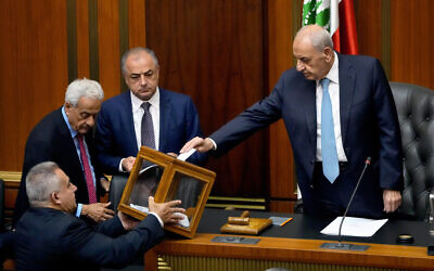 Lebanese Parliament Speaker Nabih Berri, right, casts his vote as parliament gathers to elect a president at the parliament building in downtown Beirut, Lebanon, June 14, 2023. (Hassan Ammar/AP)