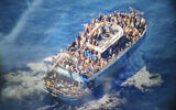 This undated handout image provided by Greece's coast guard on Wednesday, June 14, 2023, shows scores of people covering practically every free stretch of deck on a battered fishing boat that later capsized and sank off southern Greece. (Hellenic Coast Guard via AP)