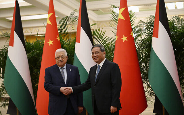 Chinese Premier Li Qiang, right, receives Palestinian Authority President Mahmoud Abbas at the Great Hall of the People in Beijing on Thursday, June 15, 2023. (Jade Gao/Pool Photo via AP)