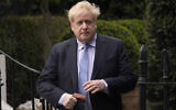 Boris Johnson leaves his house in London, on March 22, 2023. (Alberto Pezzali/AP)