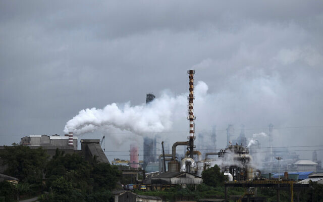 Steam emits from a crude oil refinery in Kochi, Kerala state, India, Aug. 26, 2022.  (AP Photo/R S Iyer, File)