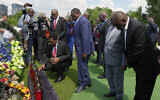 From right, South African President Cyril Ramaphosa, President of the Union of Comoros Azali Assoumani, Senegal's President Macky Sall, and Zambia's President Hakainde Hichilema, bottom, attend a commemoration ceremony at a site of a mass grave in Bucha, on the outskirts of Kyiv, Ukraine, Friday, June 16, 2023. (AP Photo/Efrem Lukatsky)