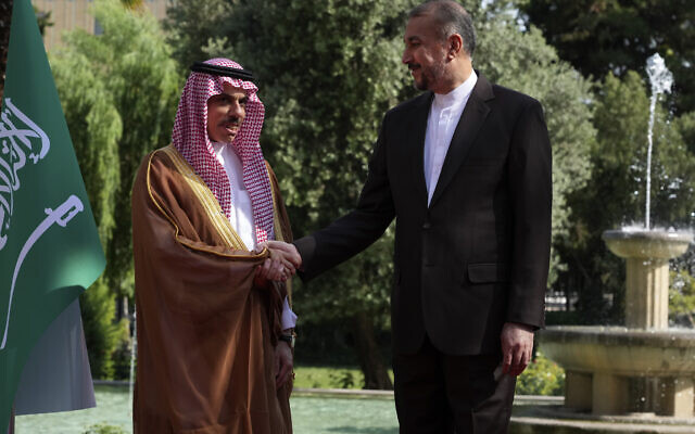 Iranian Foreign Minister Hossein Amirabdollahian, right, and his Saudi counterpart Prince Faisal bin Farhan shake hands prior to their meeting in Tehran, Iran, on June 17, 2023. (AP Photo/Vahid Salemi)