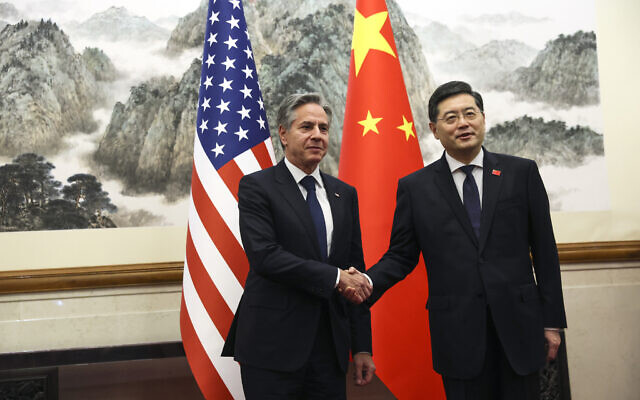 US Secretary of State Antony Blinken, left, shakes hands with Chinese Foreign Minister Qin Gang, right, at the Diaoyutai State Guesthouse in Beijing, China, June 18, 2023. (Leah Millis/Pool Photo via AP)