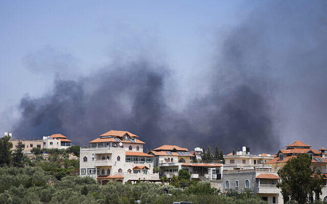Smoke rises from the West Bank town of Turmus Ayya, Wednesday, June 21, 2023. Israeli settlers set fire to Palestinian cars and homes after four Israelis were killed by Palestinian gunmen in the northern West Bank on Tuesday. (AP Photo/Ohad Zwigenberg)