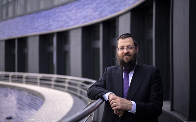 Rabbi Yehuda Teichtal poses on the balcony of the curved building of the new Jewish educational and cultural complex in Berlin, Germany, June 12, 2023. (AP Photo/Markus Schreiber)