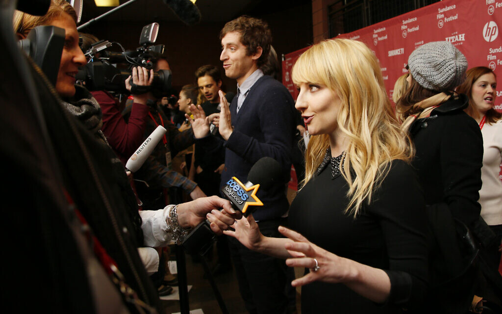 Melissa Rauch, right, and Thomas Middleditch, rear center, are interviewed at the premiere of 'The Bronze' during the 2015 Sundance Film Festival on January 22, 2015, in Park City, Utah. (Photo by Danny Moloshok/Invision/AP)
