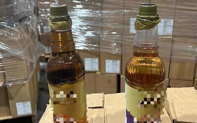 Bottles of almond syrup allegedly used to smuggle cocaine into the country, June 10, 2023. (Israel Police)