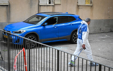 Police at the scene where a woman was shot and killed while sitting in her car in Haifa, May 8, 2023. (Flash90)
