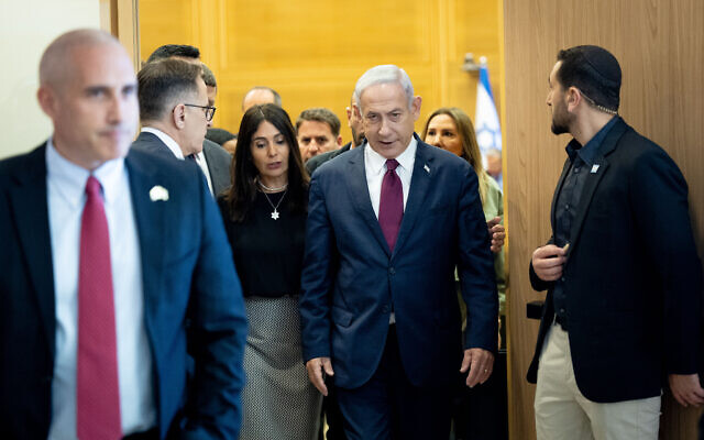 Prime Minister Benjamin Netanyahu leaves his Likud party meeting at the Knesset in Jerusalem on June 14, 2023. (Yonatan Sindel/Flash90)