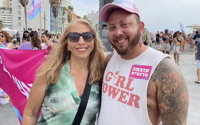 Omer Elad, right, and his mother Tami attend the Tel Aviv Pride Parade on June 8, 2023. (Carrie Keller-Lynn/Times of Israel)