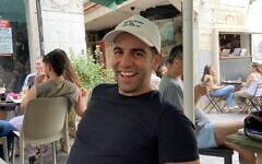 Dan Ahdoot, in his New York baseball cap, in Jerusalem, June 3, 2023 (DH / Times of Israel)