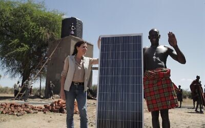 Innovation Africa founder & CEO Sivan Yaari bringing solar panels to an African village in Karamoja, Uganda. (Courtesy)