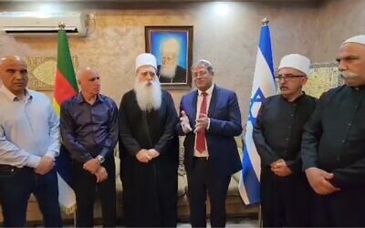 Public Security Minister Itamar Ben Gvir (center-right) meets with Druze spiritual leader Mowafaq Tarif and members of a Druze community council, June 22, 2023 (Twitter screenshot; used in accordance with clause 27a of the Copyright Law)