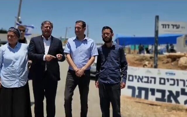 National Security Minister Itamar Ben Gvir (second left), pictured with settlement leaders at the Evyatar outpost in the West Bank, June 24, 2023, where he urged settlers to 'run for the hilltops, settle them.' (Twitter screenshot; used in accordance with clause 27a of the Copyright Law)