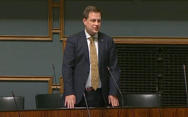 Finnish Economic Affairs Minister Vilhelm Junnila speaking in parliament in Helsinki. (YouTube screenshot; used in accordance with Clause 27a of the Copyright Law)