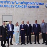 President Isaac Herzog and his wife Michal Herzog (center) and Jerusalem Mayor Moshe Lion (second from right) joined others at official opening of the Helmsley Cancer Center at Shaare Zedek Medical Center in Jerusalem, June 1, 2023. (Efrat Farjun)