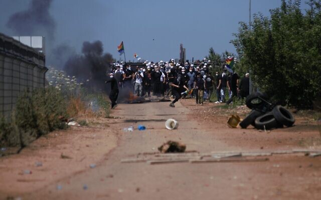 Druze face off against police during a protest against the construction of a new wind farm near the Druze village of Majdal Shams, in the Golan Heights, June 21, 2023. (Israel Police)