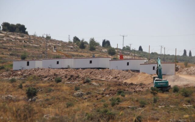 Construction equipment and caravan houses are seen at the new illegal outpost of Hamor near the West Bank settlement of Maale Levona on June 22, 2023, following a deadly terror attack at a nearby gas station two days before. (Courtesy)