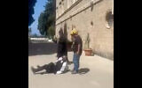 A man hits a Jewish man in video said to show an incident outside a Haifa monastery. (Screenshot, Used in accordance with Clause 27a of the Copyright Law)
