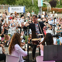 Chen Zimbalista conducts a concert in Kiryat Shmona on May 22, 2023. (Leonid Novikov)