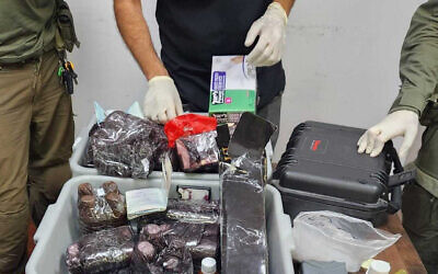 Israel Police examine UN employees kits wrongly suspected of containing liquid cocaine, that were allegedly part of an attempt to smuggle drugs into Israel from Jordan on June 25, 2023. (Israel Police)