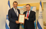 Israel Katz, national infrastructure, energy, and water minister (right) and Energean CEO Mathios Regas. (Courtesy)