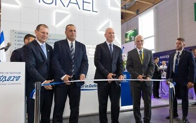 Defense Minister Yoav Gallant (center) inaugurates Israel's national pavilion at the 2023 Paris Air Show, June 19, 2023. (Ariel Hermoni/Defense Ministry)