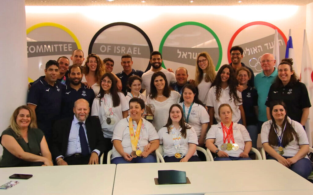 Members of the 2023 Special Olympics delegation from Israel meet with Israeli Olympic Committee president and past medalist Yael Arad (center), June 8, 2023. (Ben Melnik)