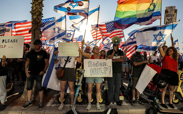 Protesters demonstrate against the judicial overhaul, outside the US embassy branch office in Tel Aviv, July 11, 2023. (Menahem Kahana/AFP)