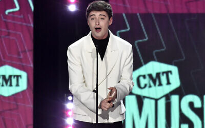 Noah Schnapp presents the award for collaborative video of the year at the CMT Music Awards at the Moody Center in Austin, Texas, on April 2, 2023. (Evan Agostini/Invision/AP)