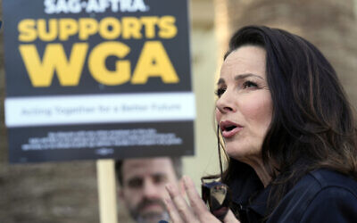 Fran Drescher, president of SAG-AFTRA, is interviewed at a Writers Guild of America rally outside Paramount Pictures studio, May 8, 2023, in Los Angeles. (AP Photo/Chris Pizzello)