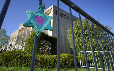A Star of David hangs from a fence outside the dormant landmark Tree of Life synagogue in Pittsburgh's Squirrel Hill neighborhood, April 19, 2023. (Gene J. Puskar/AP)