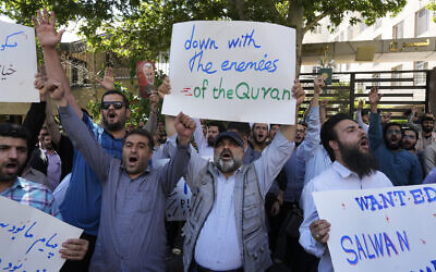 Iranian demonstrators chant slogans during a protest of the burning of a Quran in Sweden, in front of the Swedish Embassy in Tehran, Iran, June 30, 2023. (Vahid Salemi/AP)