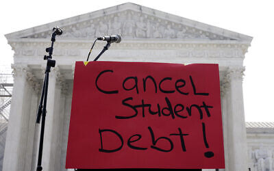 A sign reading 'cancel student debt' is seen outside the Supreme Court, Friday, June 30, 2023, in Washington. (AP/Mariam Zuhaib)