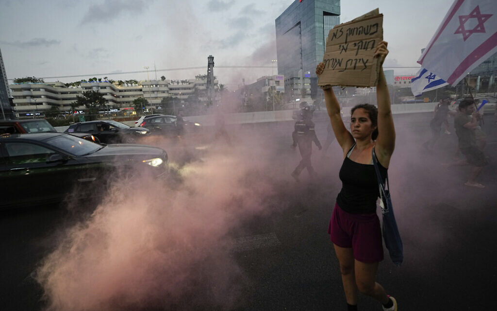 Israeli demonstrators block a freeway during a protest against plans by Prime Minister Benjamin Netanyahu's government to overhaul the judicial system, in Tel Aviv, Israel, Saturday, July 1, 2023. (AP/Ariel Schalit)