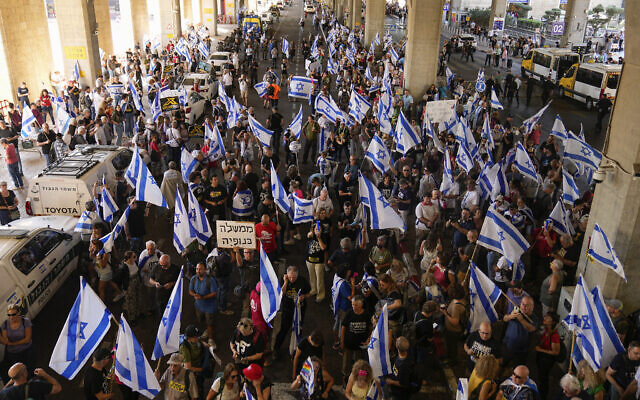 Israelis protest against plans by Prime Minister Benjamin Netanyahu's government to overhaul the judicial system, at Ben Gurion Airport near Tel Aviv, July 3, 2023. (AP Photo/ Ohad Zwigenberg)
