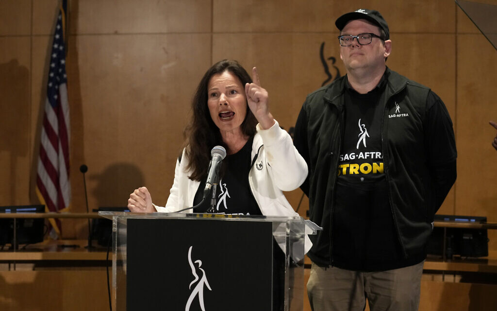SAG-AFTRA president Fran Drescher, left, and SAG-AFTRA National Executive Director and Chief Negotiator Duncan Crabtree-Ireland speak during a press conference announcing a strike by The Screen Actors Guild-American Federation of Television and Radio Artists on Thursday, July, 13, 2023, in Los Angeles. This marks the first time since 1960 that actors and writers will picket film and television productions at the same time. (AP Photo/Chris Pizzello)