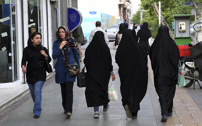 Illustrative: Iranian women make their way along a sidewalk in downtown Tehran, Iran, April 26, 2016. (Vahid Salemi/AP)