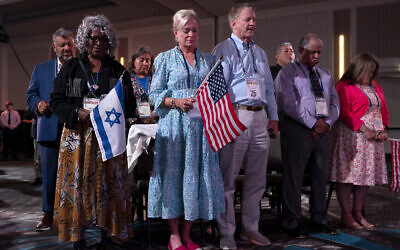 Illustrative: Holding US and Israeli flags, a crowd of largely Evangelical Christians pray during the Christians United For Israel (CUFI) 'Night to Honor Israel' during the CUFI Summit 2023, in Arlington, Virginia, at the Crystal Gateway Marriott, July 17, 2023. (Jacquelyn Martin/AP)