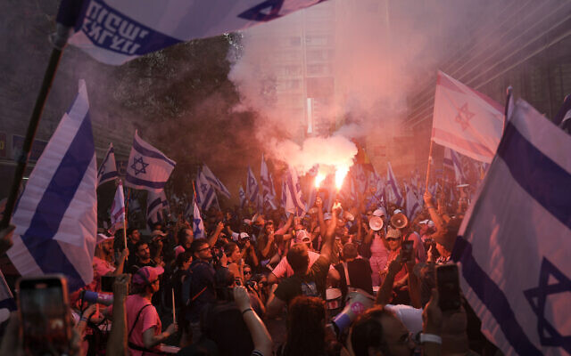 Israelis protest against plans by Prime Minister Benjamin Netanyahu's government to overhaul the judicial system in Tel Aviv, Israel, July 18, 2023. (AP Photo/Oded Balilty)