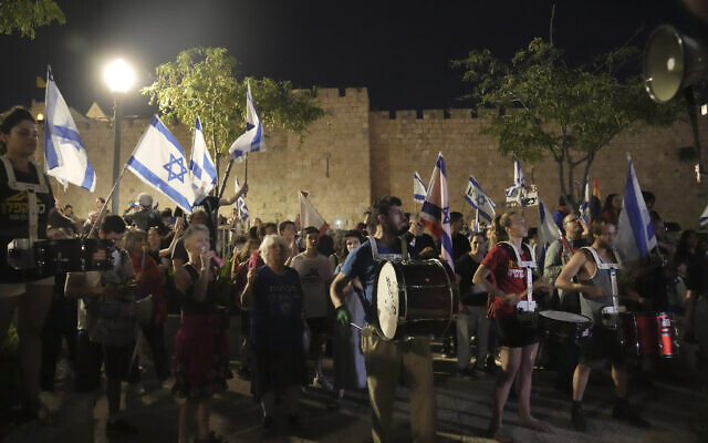 Israelis protest against plans by Prime Minister Benjamin Netanyahu's government to overhaul the judicial system, outside of the Old City walls in Jerusalem, Thursday, July 20, 2023. (AP/Mahmoud Illean)