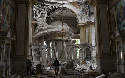 Church personnel inspect damage inside the Odesa Transfiguration Cathedral following Russian missile attacks in Odesa, Ukraine, July 23, 2023. (Jae C. Hong/AP)