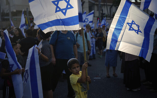 Right-wing Israelis rally in support of Prime Minister Benjamin Netanyahu's government plans to overhaul the judicial system, in Tel Aviv, Israel, Sunday, July 23, 2023. (AP Photo/Ariel Schalit)