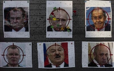 Darts are stuck on a paper target made with an image of Russian President Vladimir Putin at a popular beachside attraction in Odesa, Ukraine, July 23, 2023. (Jae C. Hong/AP)