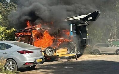 A vehicle carrying pride flags is set ablaze in Hod Hasharon on July 7, 2023. (Courtesy)