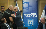 Prime Minister Benjamin Netanyahu (center) embraces Likud activist Itzik Zarka during a party faction meeting at the Knesset on July 9, 2018 (Hadas Parush/Flash90)