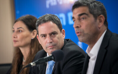 Newly elected head of the Israel Bar Association Amit Becher, center, with members of the IBA's election committee during a press conference in Tel Aviv, June 21, 2023. (Miriam Alster/Flash90)