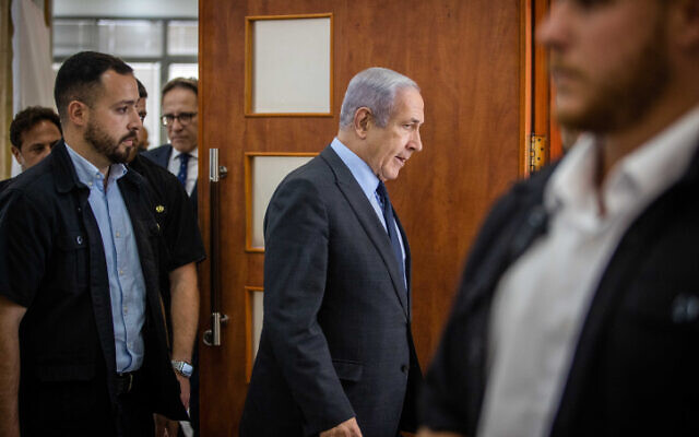 Prime Minister Benjamin Netanyahu seen at the Jerusalem District Court during the testimony of businessman Arnon Milchan in Netanyahu's corruption trial, July 2, 2023. (Oren Ben Hakoon/POOL)